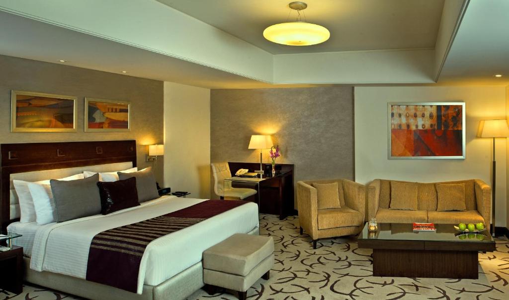 Postel nebo postele na pokoji v ubytování Fortune Park, Ahmedabad - Member ITC Hotels' Group