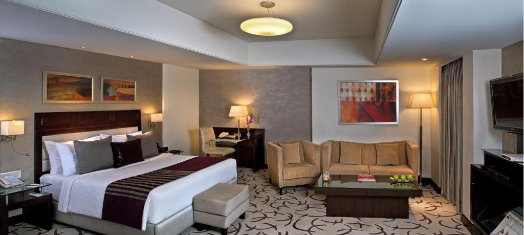 Postel nebo postele na pokoji v ubytování Fortune Park, Ahmedabad - Member ITC Hotels' Group