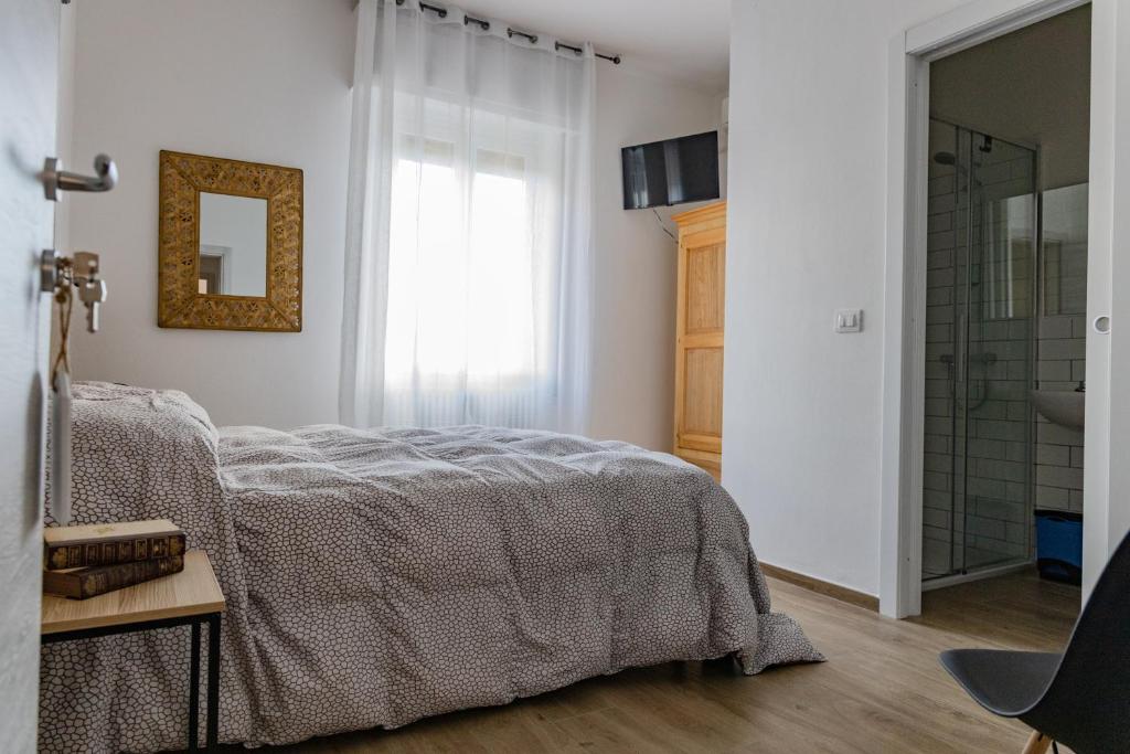 Postel nebo postele na pokoji v ubytování Affittacamere l'Aurora