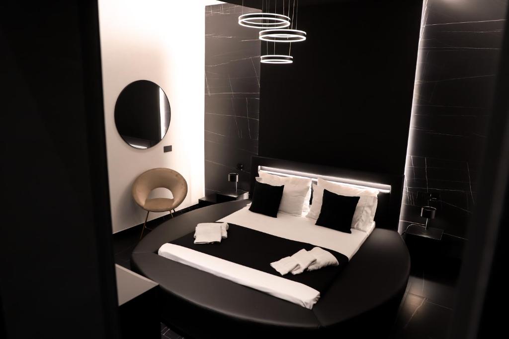 Postel nebo postele na pokoji v ubytování 115 Luxury Suite - Privitera