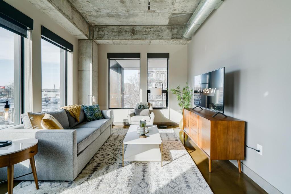 a living room with a couch and a table at Sable 21 - One Bedroom in Minneapolis