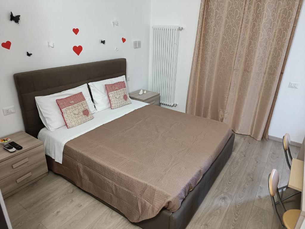 Postel nebo postele na pokoji v ubytování Le Coccole