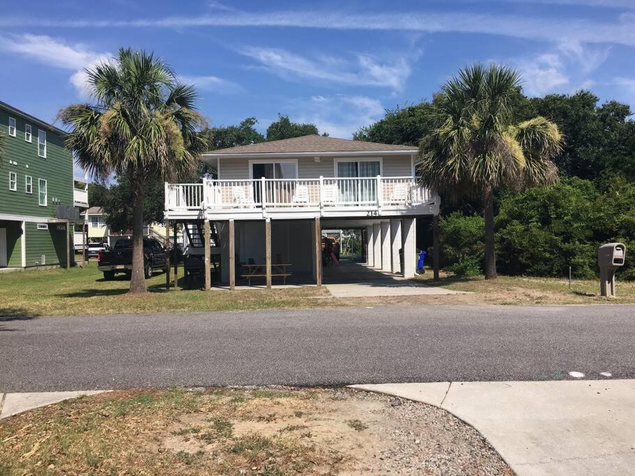 a house with a white deck and palm trees at Surfside Beach/ Capt. Jacks ~50 FT From Beach 3br/3ba in Myrtle Beach