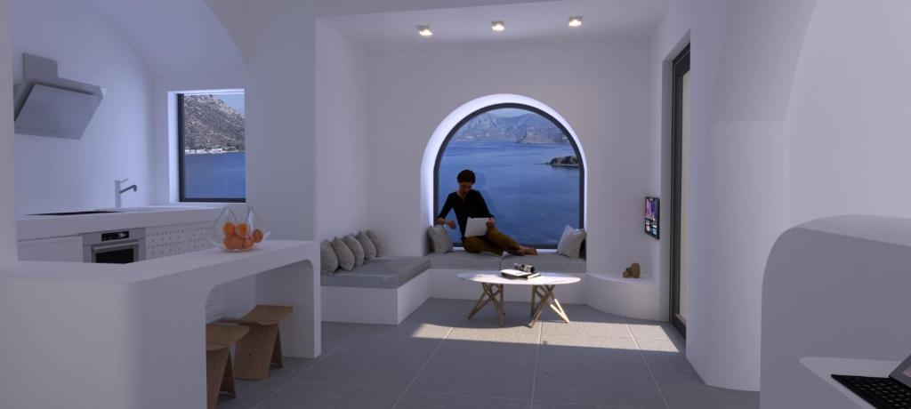 a man sitting on a bench in a room with a window at Shape-Meander in Kalymnos