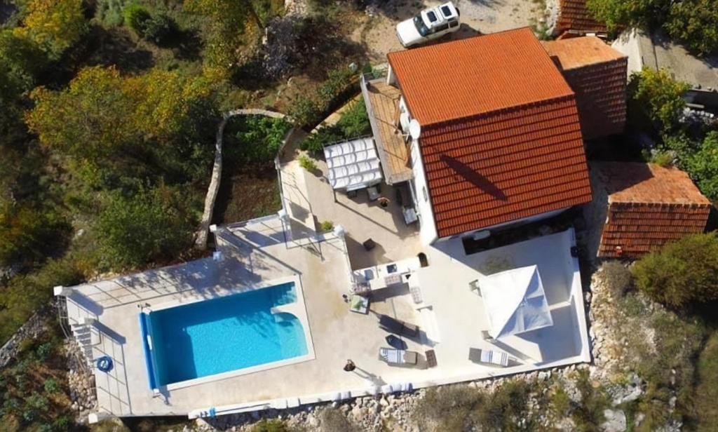 A bird's-eye view of Villa Elysium with heated pool