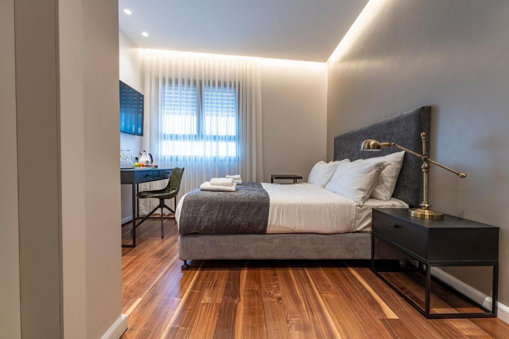 Postel nebo postele na pokoji v ubytování Hematian Hotel by Effy