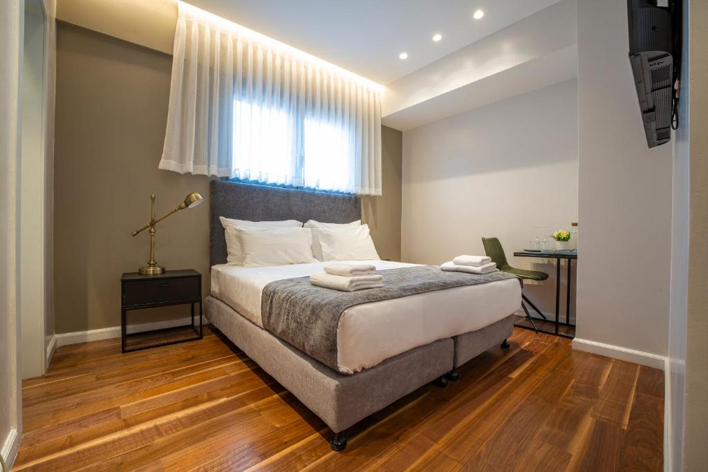 Postel nebo postele na pokoji v ubytování Hematian Hotel by Effy