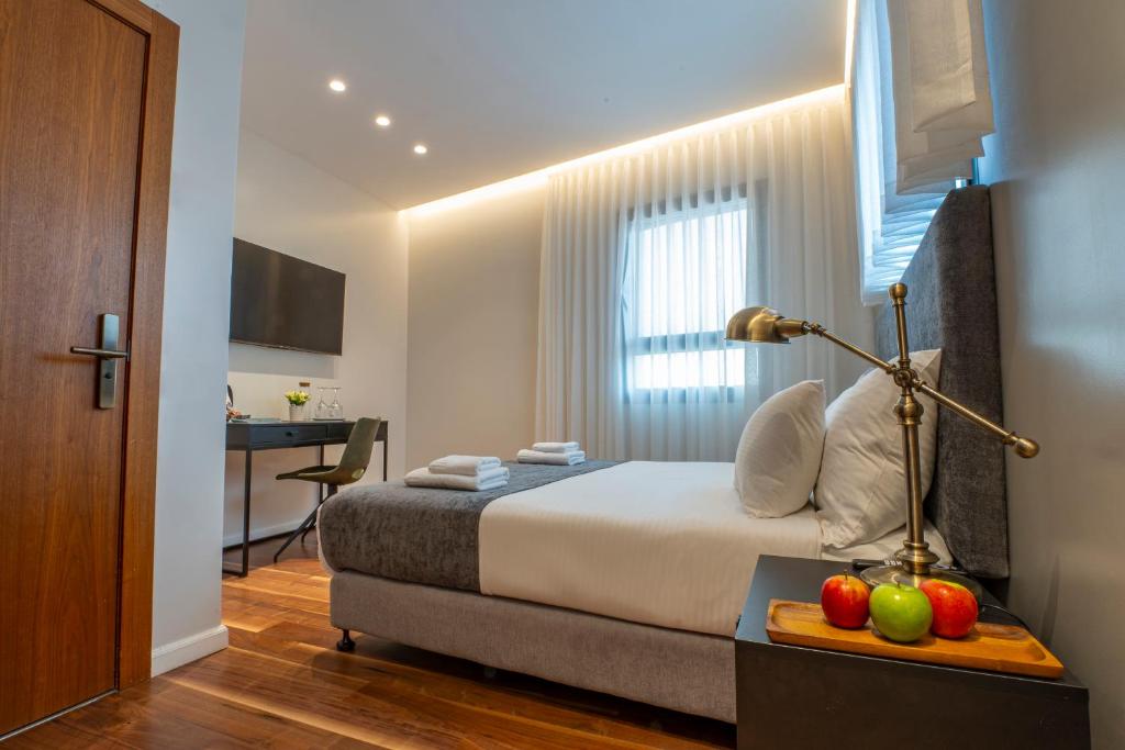 TV a/nebo společenská místnost v ubytování Hematian Hotel by Effy