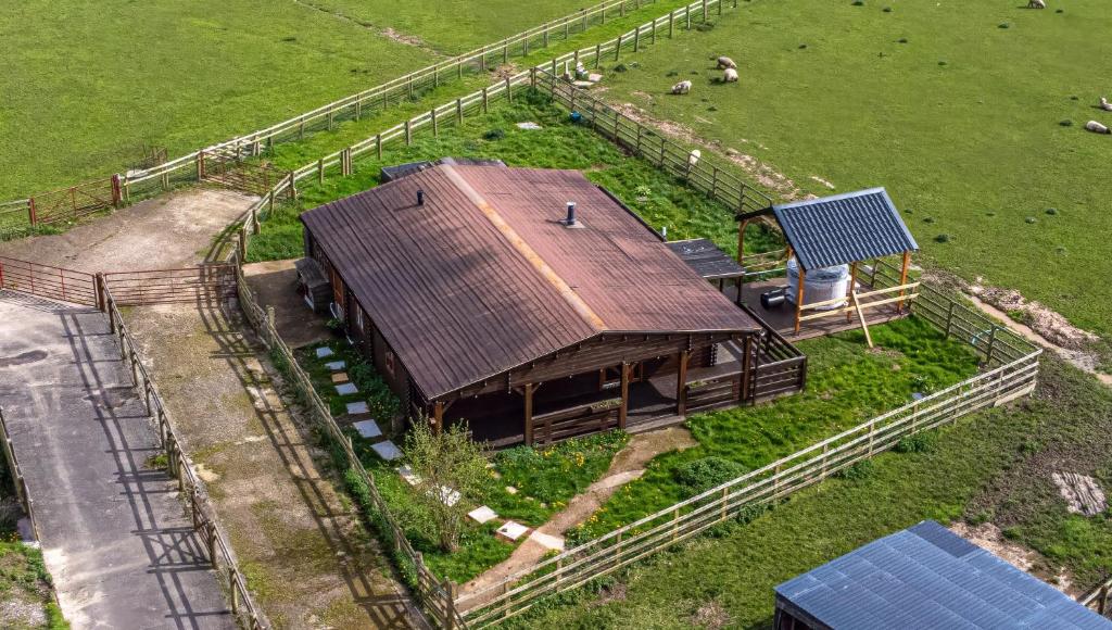 an overhead view of a barn in a field at Reindeer Lodge by StayStaycations 