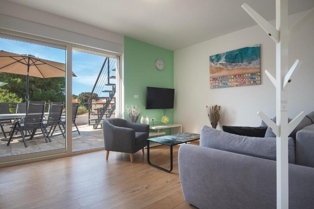 TV a/nebo společenská místnost v ubytování Apartment Klara