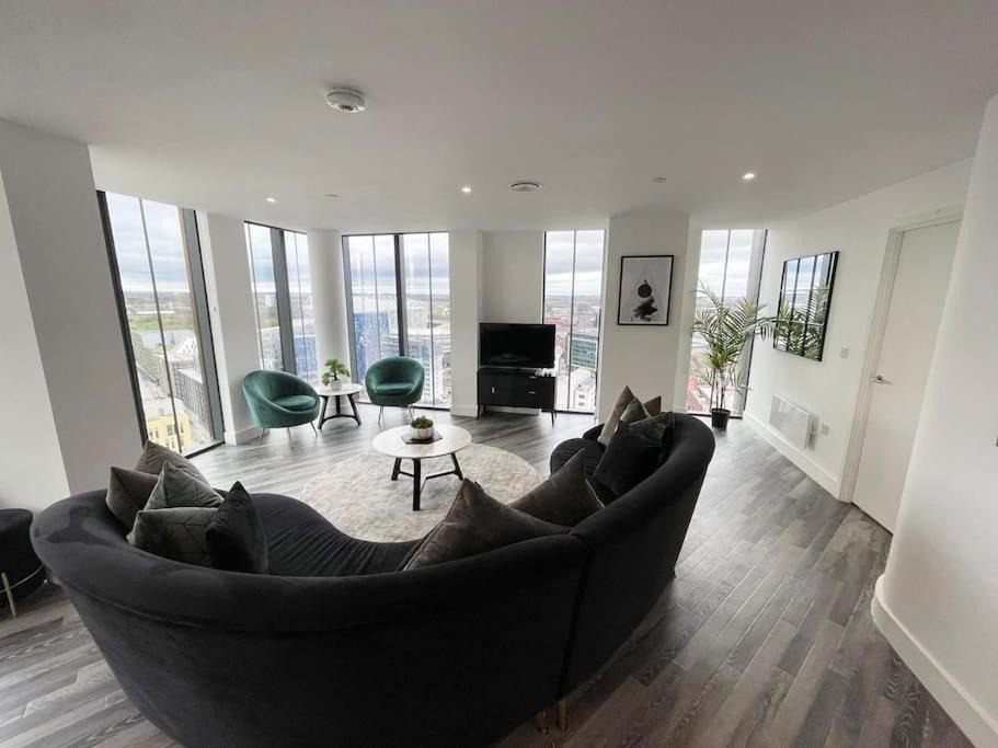 a large living room with a large couch and chairs at Opulent 3 -Bedroom Penthouse with Stunning Views in Newcastle upon Tyne