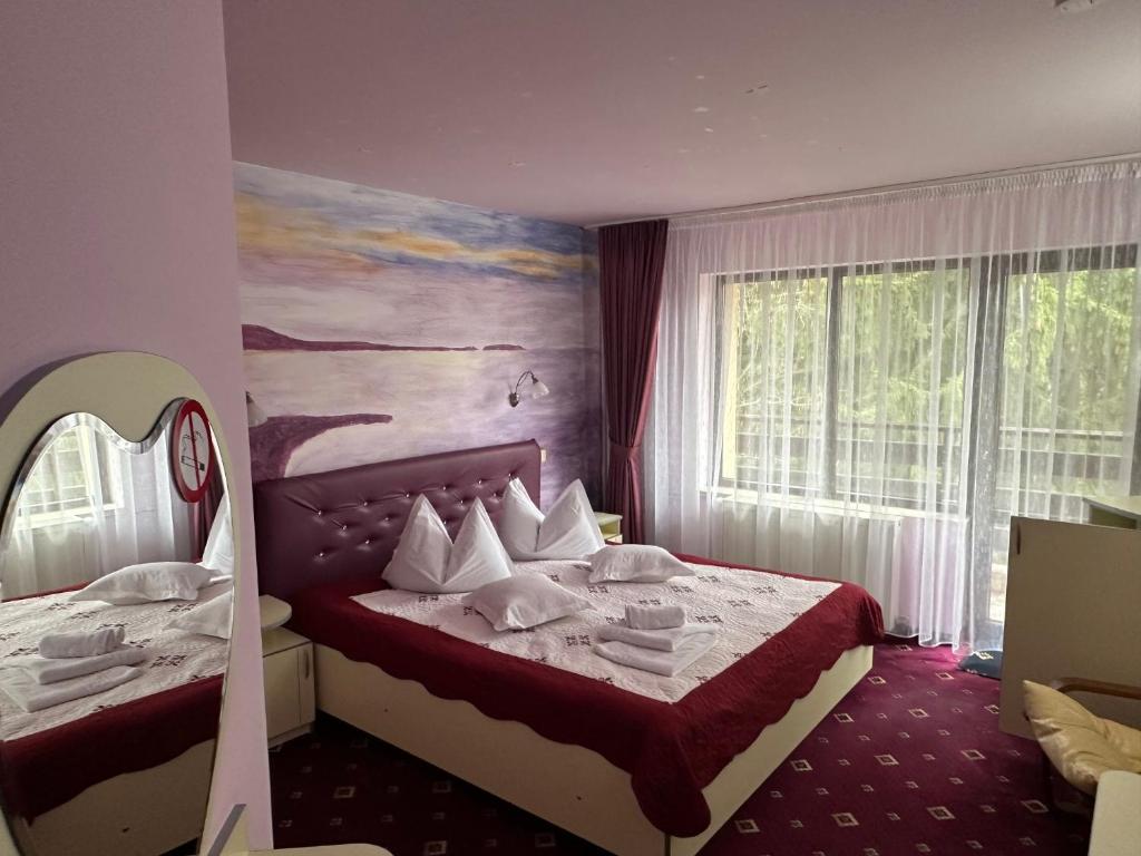 Postel nebo postele na pokoji v ubytování Casa Cioplea by Genco