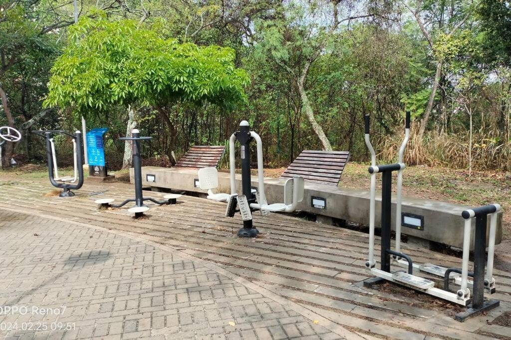 a row of exercise equipment on a boardwalk at Apartamento Fontana in Bucaramanga
