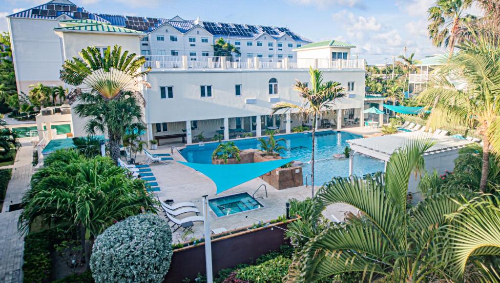 an aerial view of a resort with a swimming pool at Seven Mile Beach Resort in West Bay