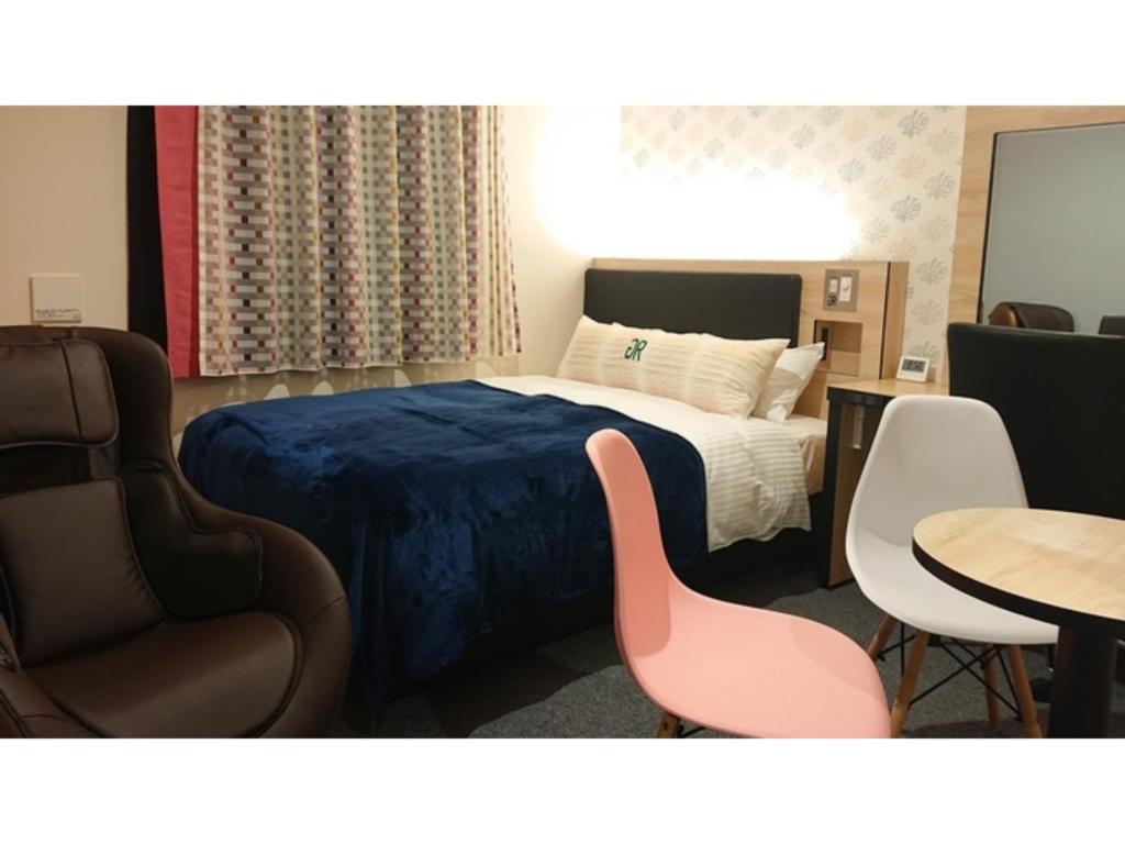 Postelja oz. postelje v sobi nastanitve Green Rich Hotel Okinawa Nago - Vacation STAY 55394v