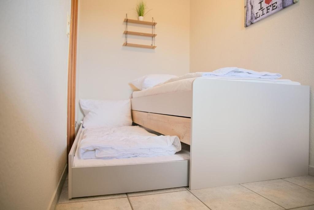Postel nebo postele na pokoji v ubytování Grömitz- Center II App 18 inkl WLAN