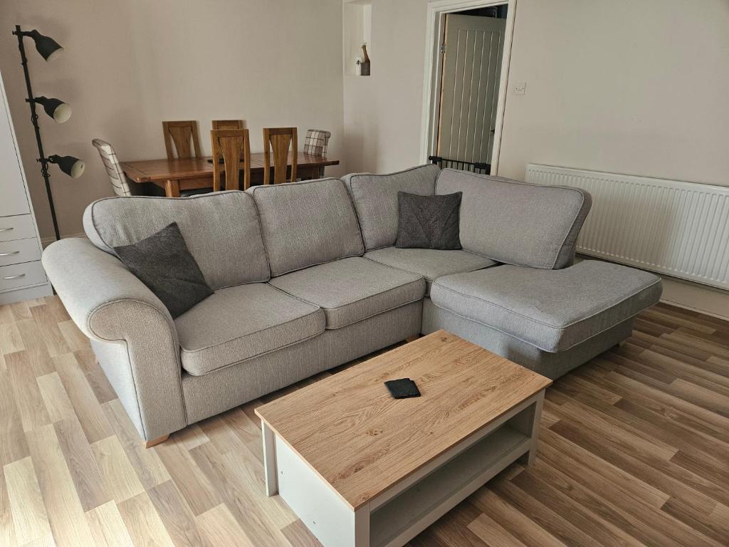 a living room with a couch and a coffee table at Close to amenities in Weston-super-Mare