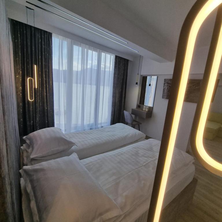 Postel nebo postele na pokoji v ubytování Donau Resort