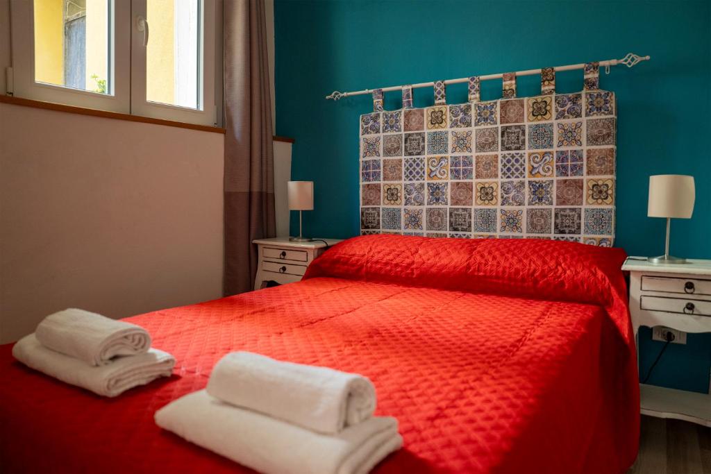 Postel nebo postele na pokoji v ubytování Guglielmo's House Bed & Breakfast