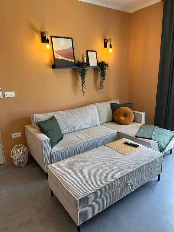 a living room with a couch and a table at Augustin. welcome home in Duće