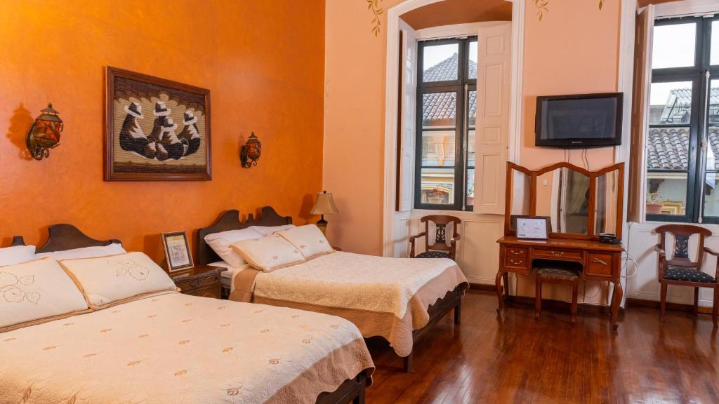 Postel nebo postele na pokoji v ubytování Casa Colonial Quito