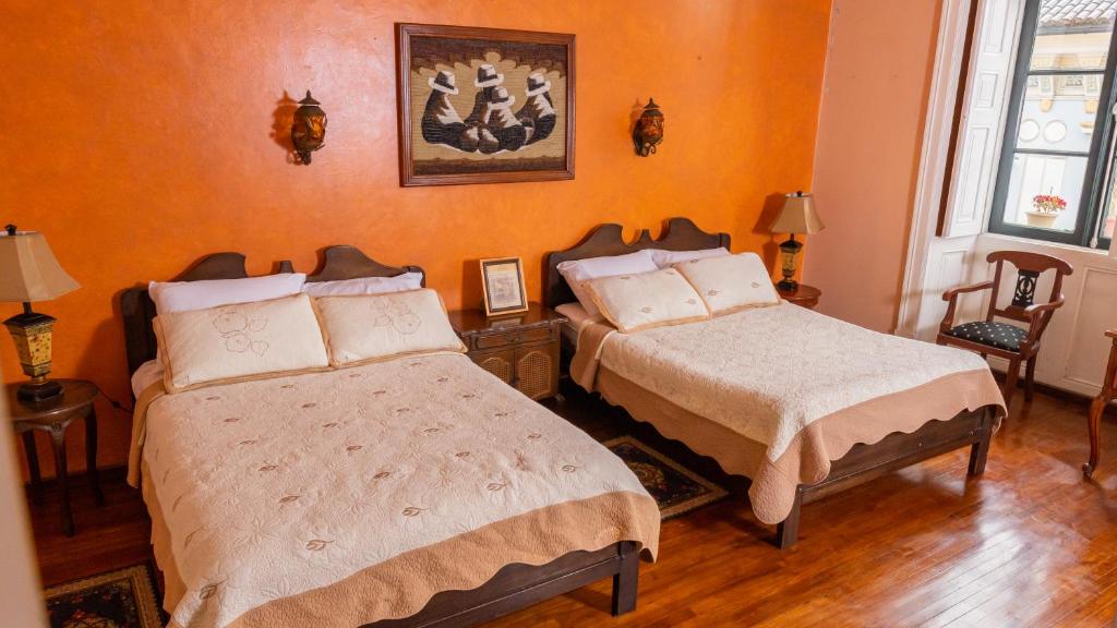 Postel nebo postele na pokoji v ubytování Casa Colonial Quito