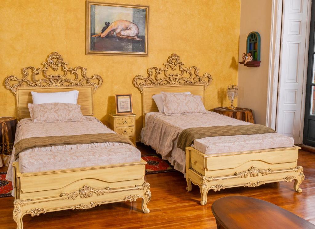 Postel nebo postele na pokoji v ubytování Casa Colonial Quito