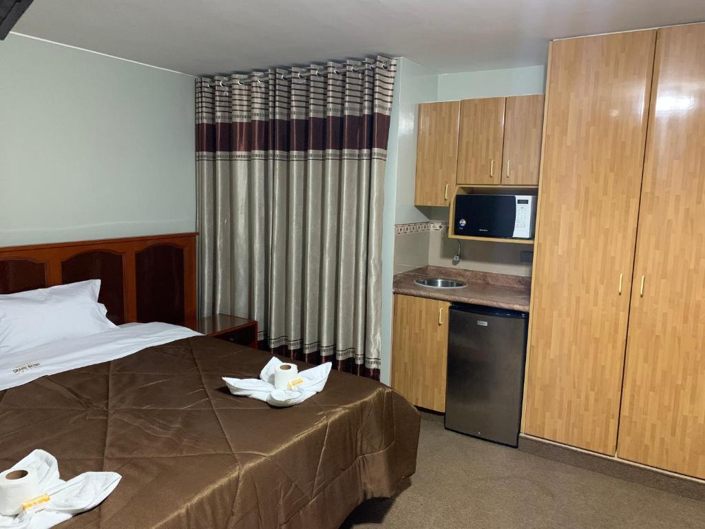 Postel nebo postele na pokoji v ubytování Grand Hotel Betsy
