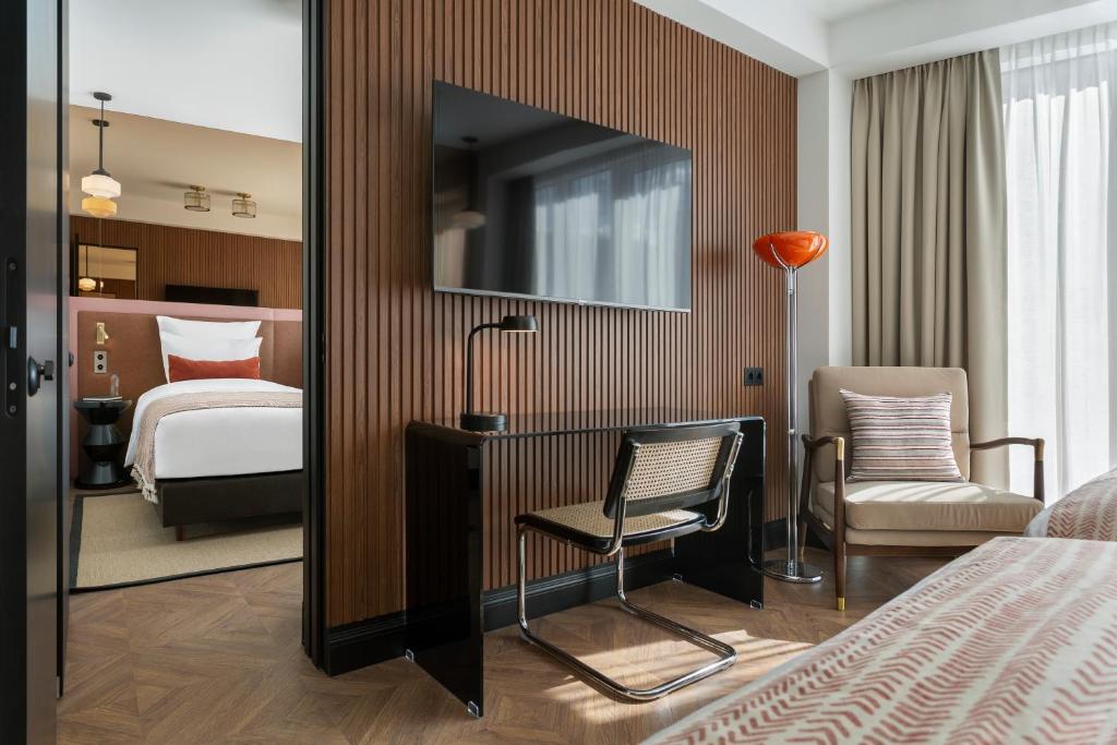 Postel nebo postele na pokoji v ubytování Artizan - Design Hotel