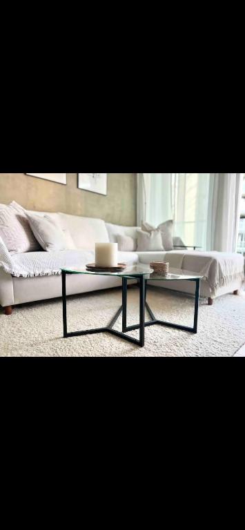 a living room with a couch and a coffee table at Open vibes in Woodbury