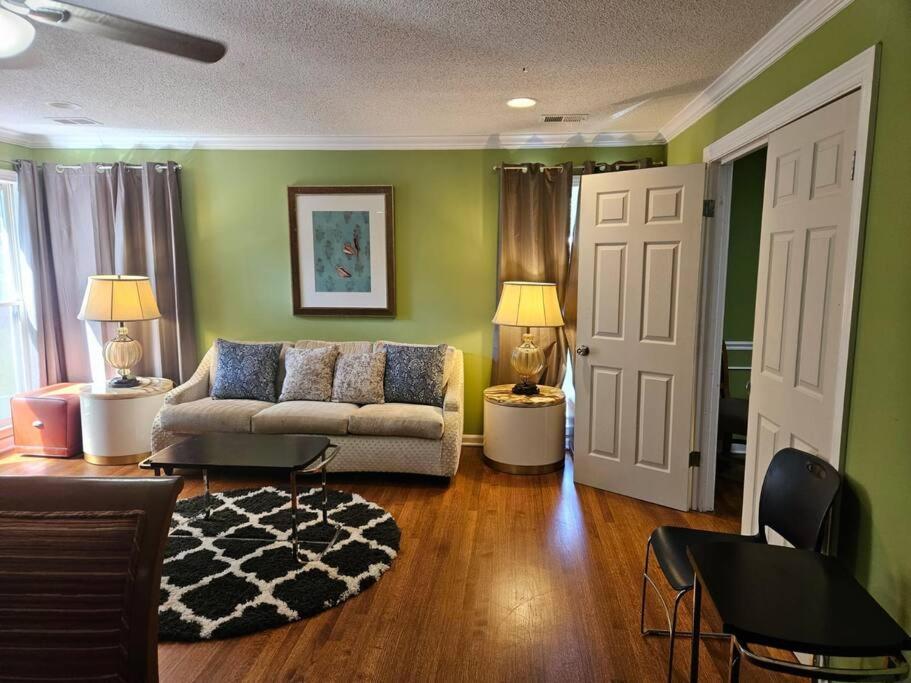 a living room with green walls and a couch at 6BR in Suburban area close to Freeway and Galeria in Memphis