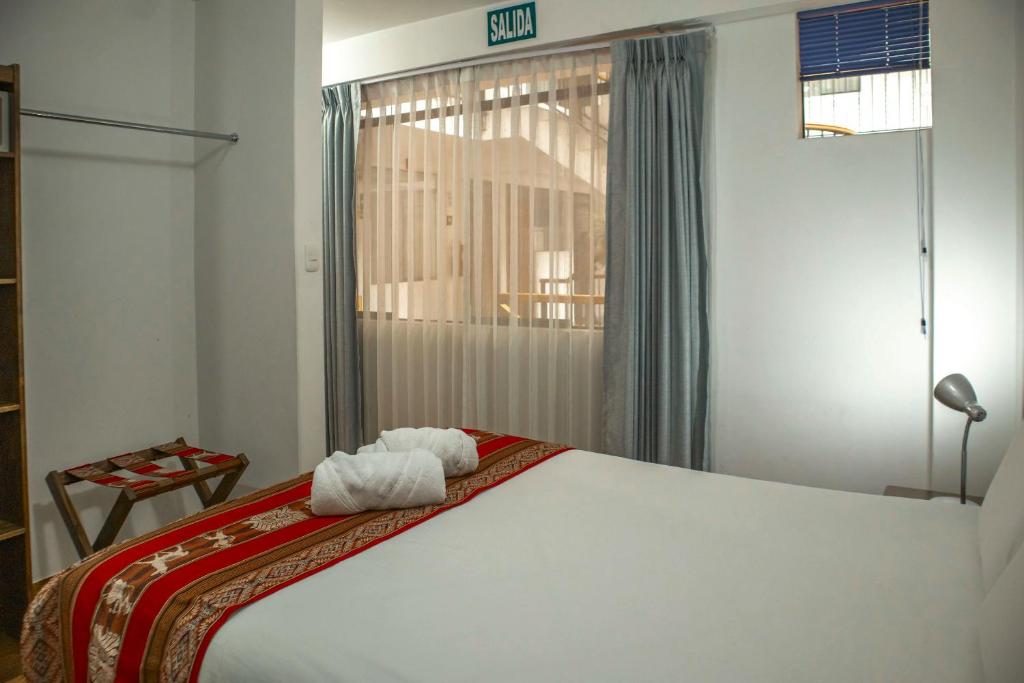 Postel nebo postele na pokoji v ubytování Hotel Del Prado Hometown