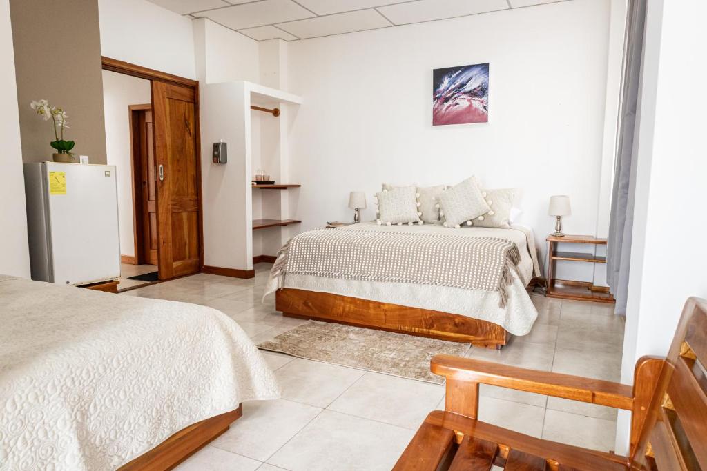 Postel nebo postele na pokoji v ubytování HOTEL AYRE By Baltra