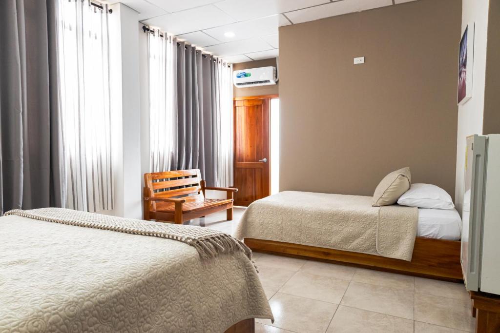 Postel nebo postele na pokoji v ubytování HOTEL AYRE By Baltra