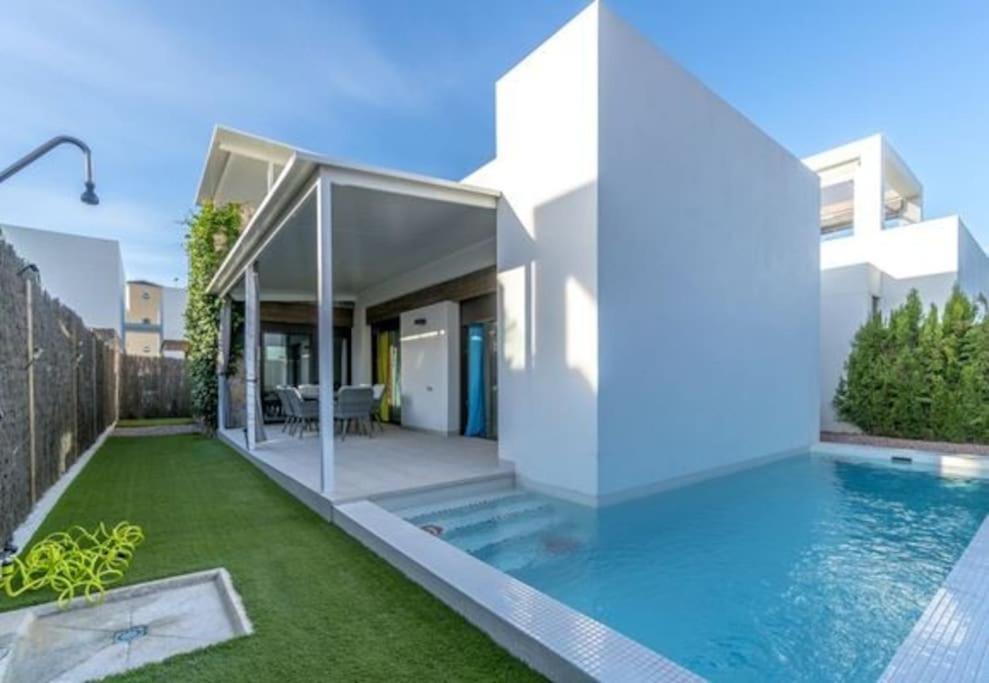 an image of a house with a swimming pool at VillaHeLena in Orihuela Costa