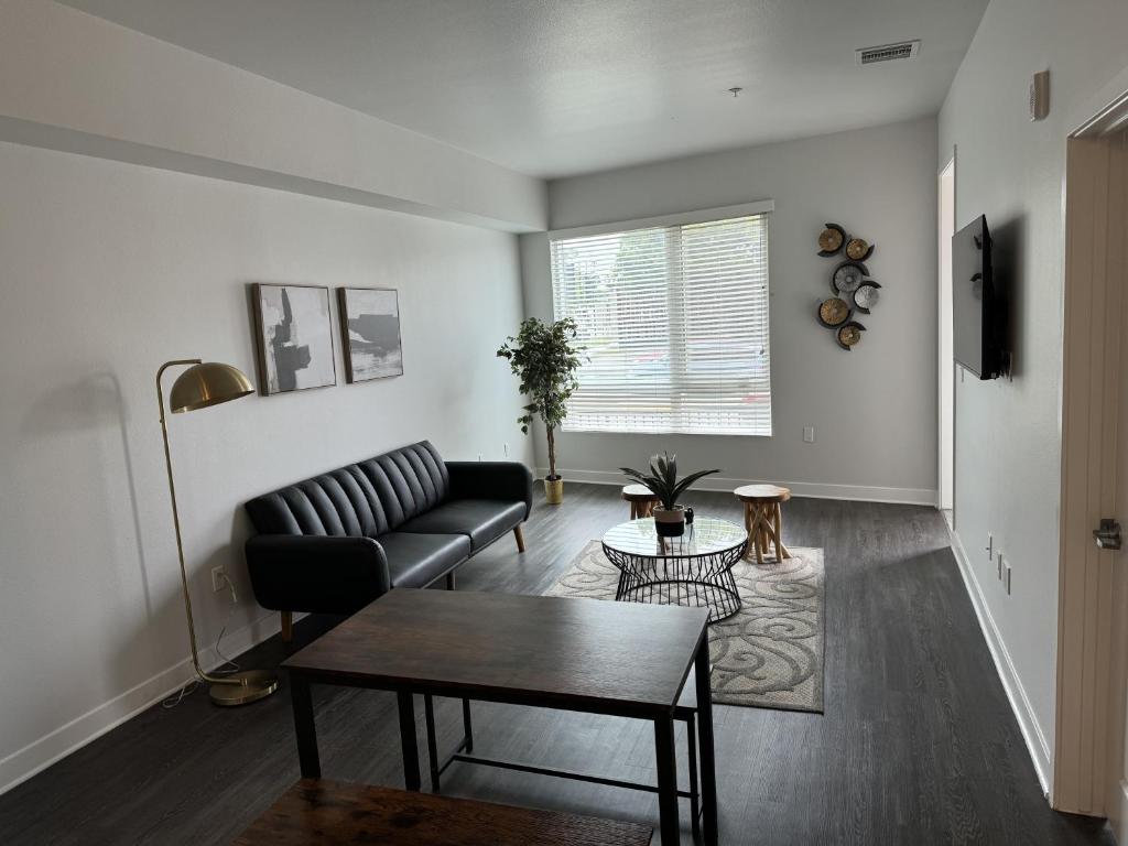 a living room with a couch and a table at Chic Luxury Condo near Hollywood in Glendale