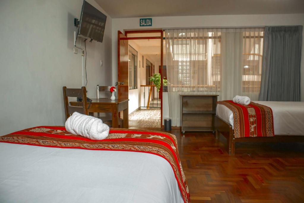 Postel nebo postele na pokoji v ubytování Hotel Del Prado Hometown