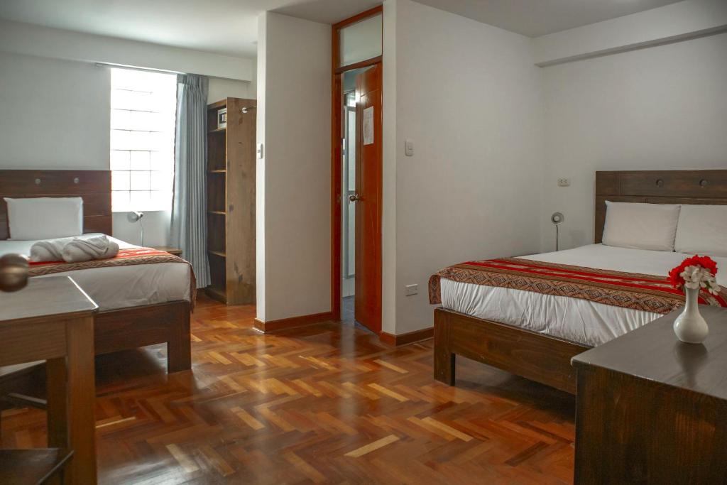 Postel nebo postele na pokoji v ubytování Hotel Del Prado Hometown