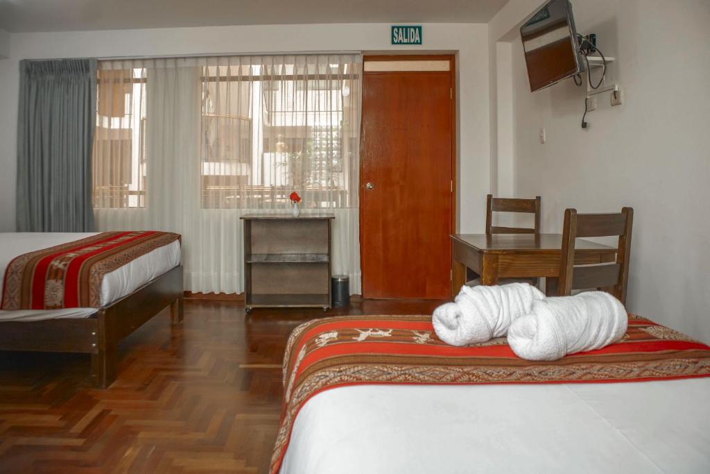 Postel nebo postele na pokoji v ubytování Hotel Del Prado Hometown