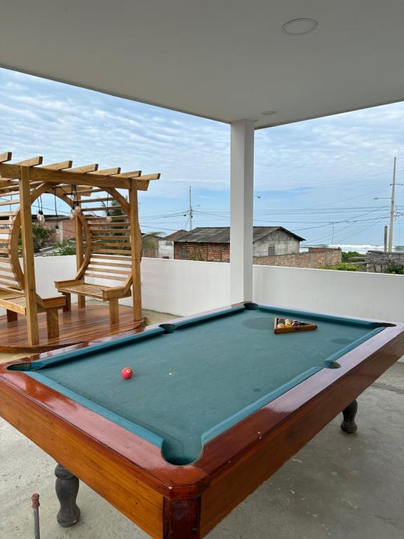 a pool table sitting on top of a patio at Villasrock2022 in San Clemente