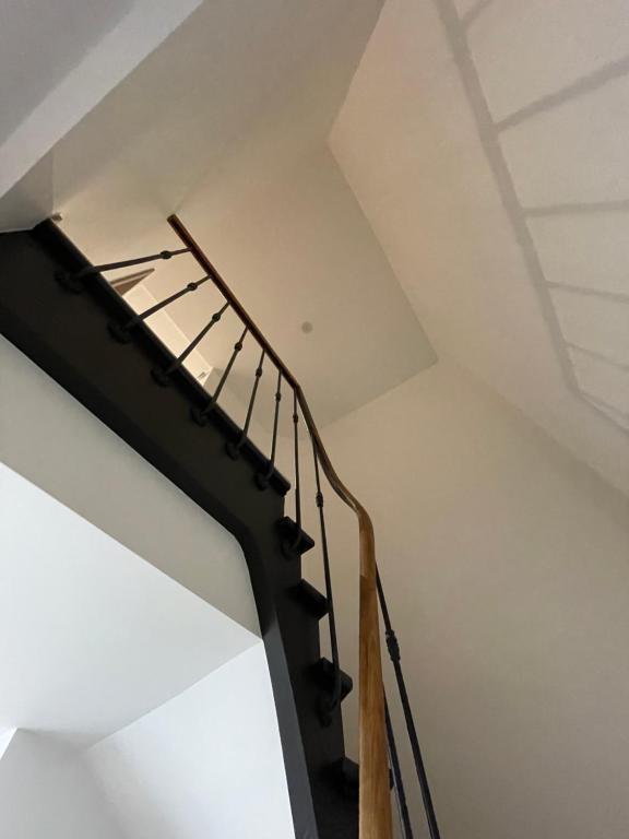 a staircase in a house with a ceiling at Colocation à côté d’Artem in Vandoeuvre-lès-Nancy