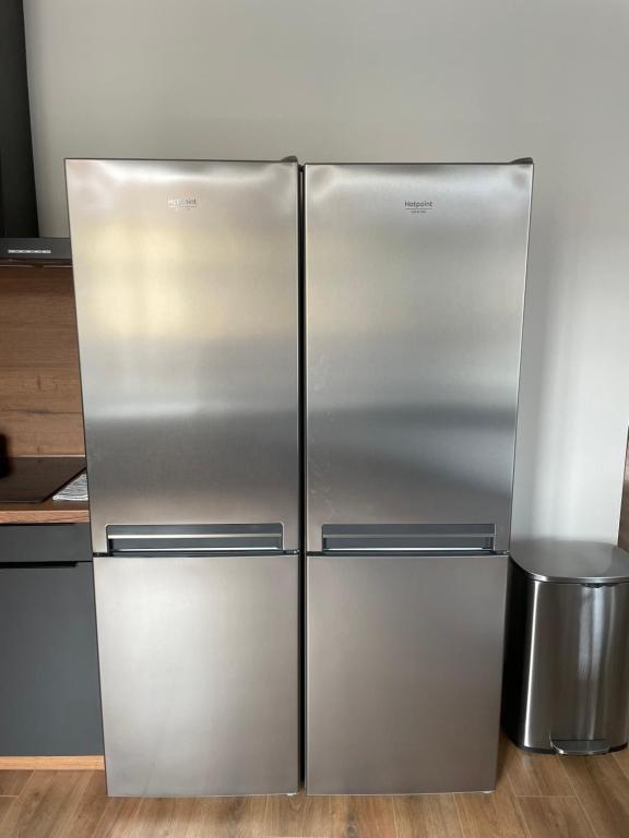 a stainless steel refrigerator in a kitchen at Colocation à côté d’Artem in Vandoeuvre-lès-Nancy
