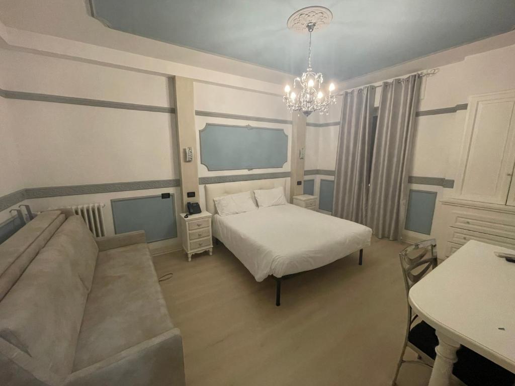 Postel nebo postele na pokoji v ubytování Hotel Central Giacomini