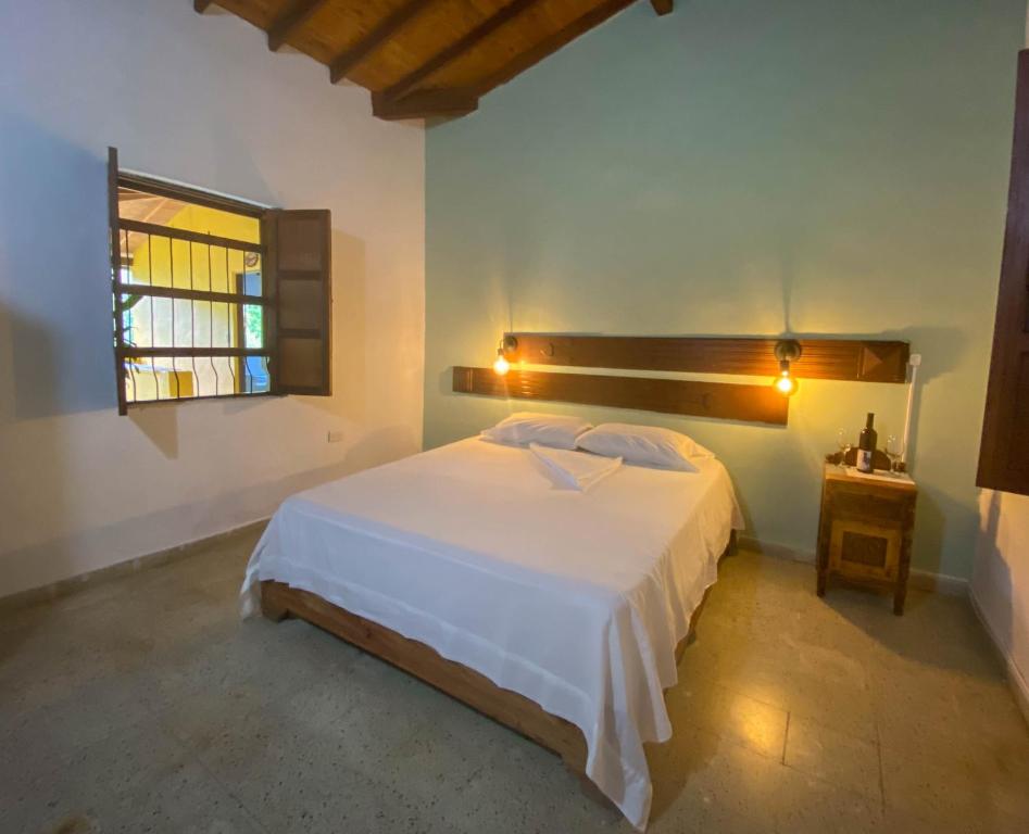 Postel nebo postele na pokoji v ubytování EcoHotel Casa Maria Parda