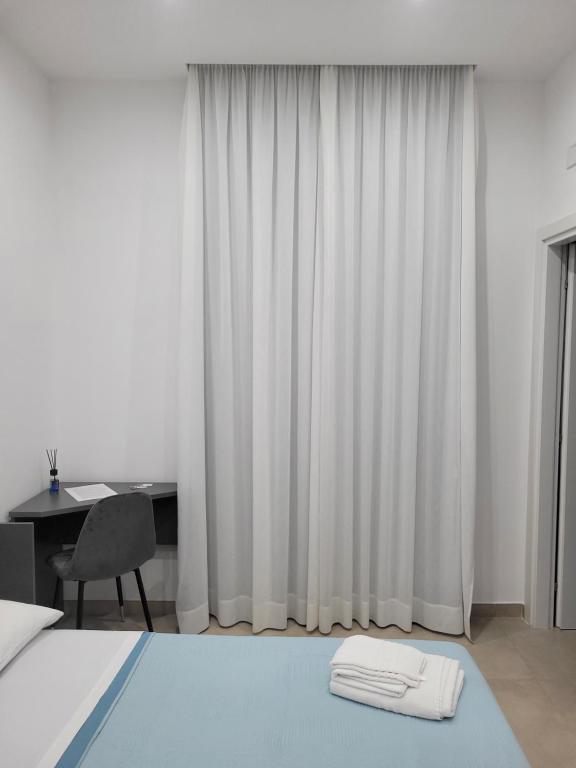 Postel nebo postele na pokoji v ubytování Gemini rooms