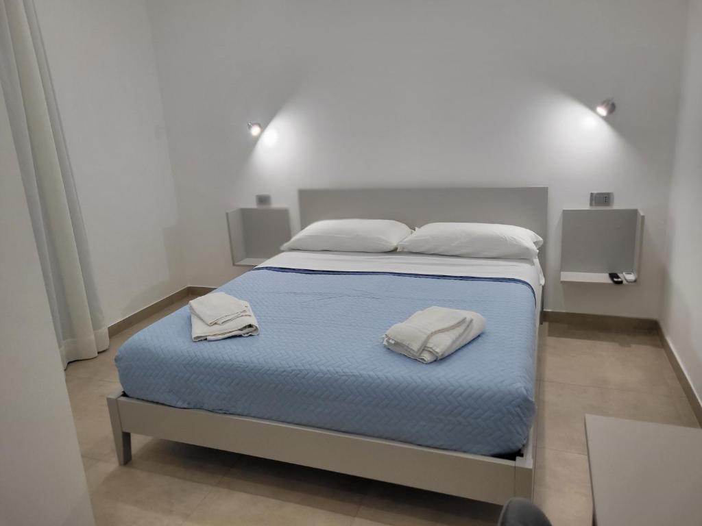 Postel nebo postele na pokoji v ubytování Gemini rooms