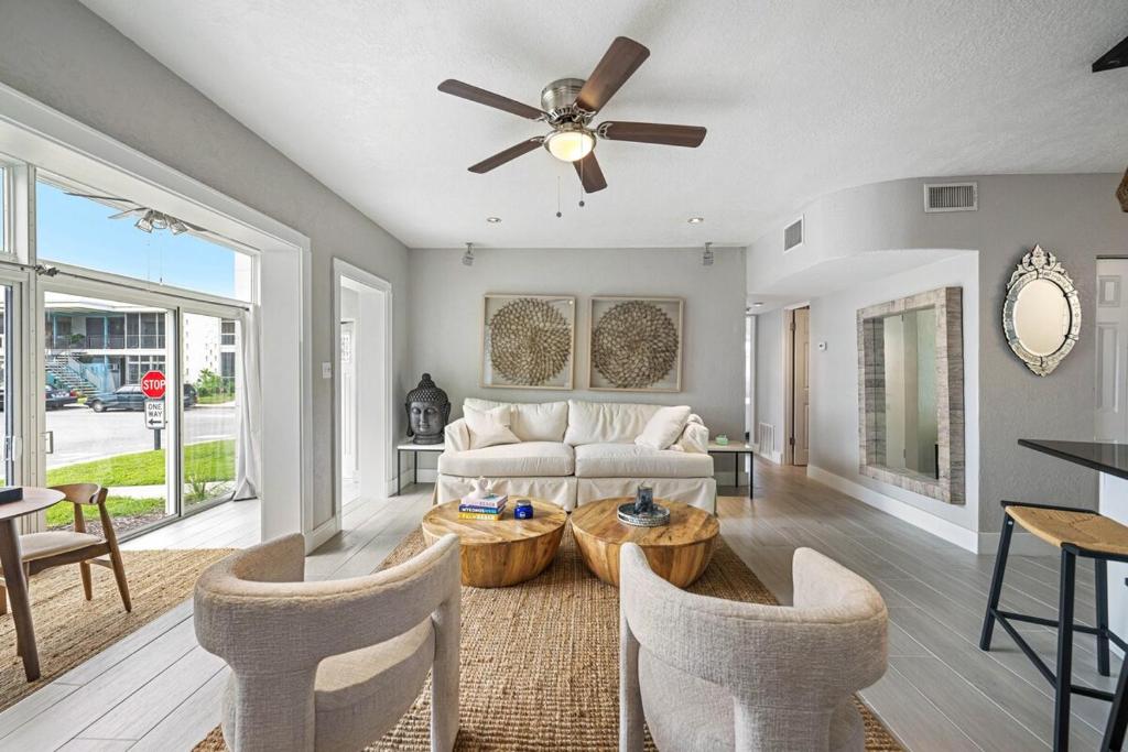 a living room with a couch and a ceiling fan at Gorgeous Property at Winter Park in Orlando