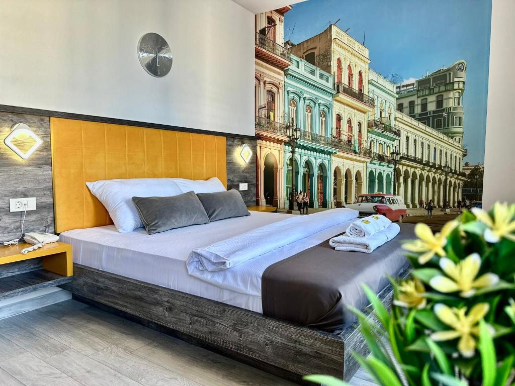 a bedroom with a large bed in front of a building at Art-Hotel Del Medio in Sutomore