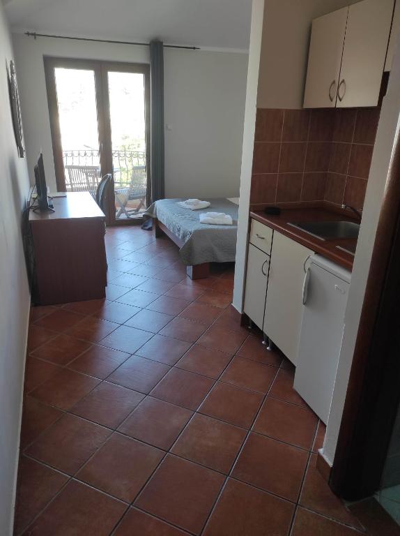 Kuchyň nebo kuchyňský kout v ubytování Garni Hotel Meduza