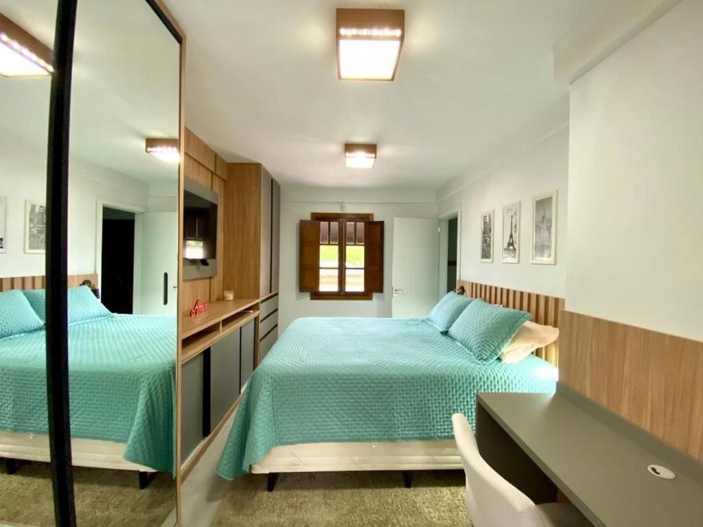 Postel nebo postele na pokoji v ubytování Villaggio dos Vinhedos
